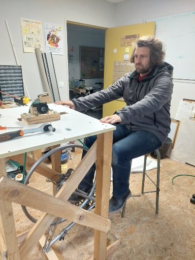 Julien Colomb pedalling on a pedal powered machine.